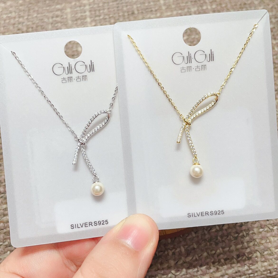 古丽古丽银饰新款S925银镀金微镶珍珠蝴蝶结时尚锁骨项链女图片