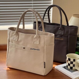 日系简约通勤刺绣加厚帆布手提包文艺日常百搭便携学生餐盒托特包