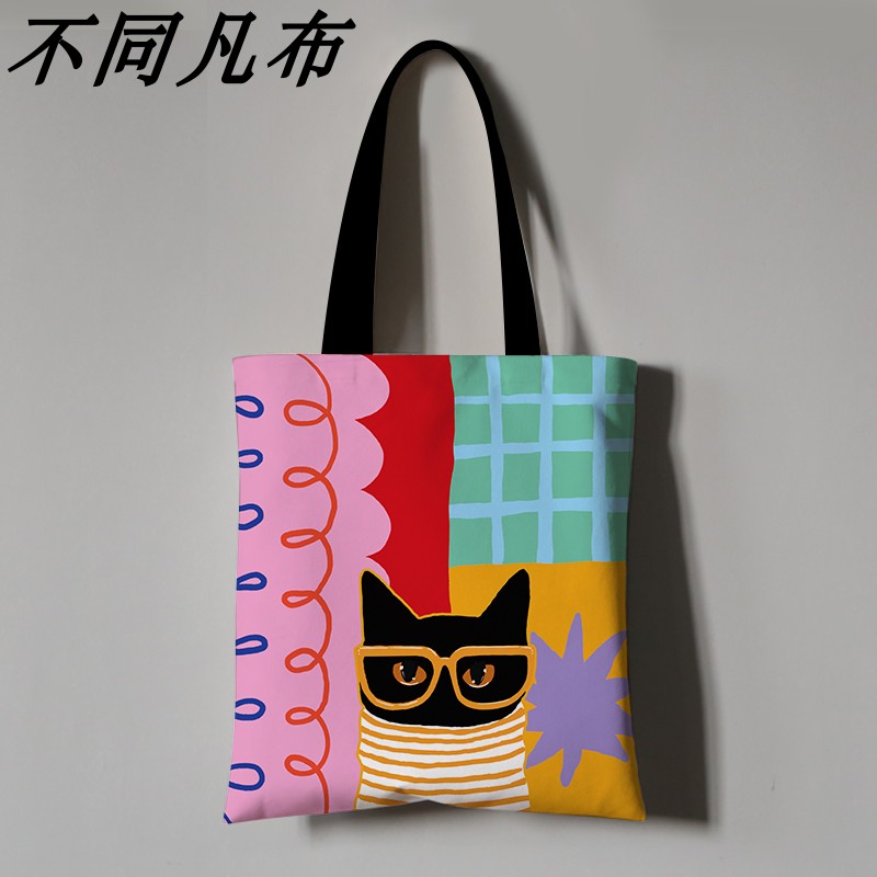 橘黄色毛衣猫咪大容量帆布袋拼色亮色插画学生单肩包创意多巴胺袋