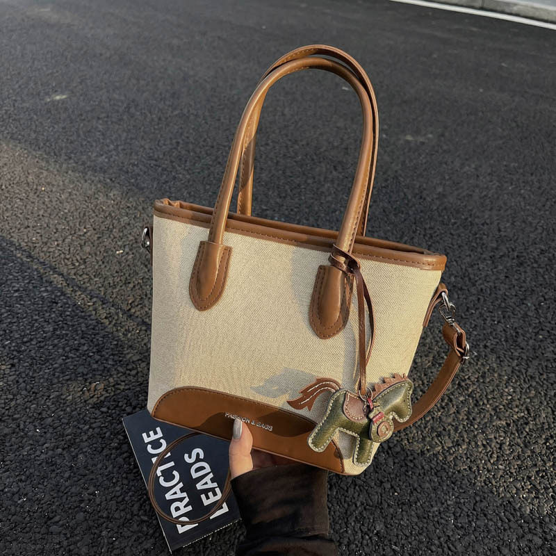 韩版百搭拼接手提水桶包女2026新款时尚帆布单肩包休闲通勤斜挎包,箱包皮具/热销女包/男包,水桶包,淘宝优惠券,粉丝福利购,淘宝优惠卷