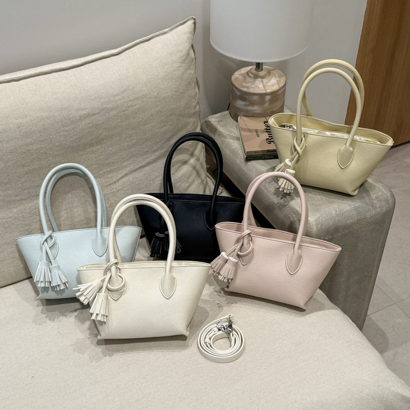 韩国小众流苏水桶包手提菜篮子包包女2026春季新款通勤单肩斜挎包,箱包皮具/热销女包/男包,水桶包,淘宝优惠券,粉丝福利购,淘宝优惠卷