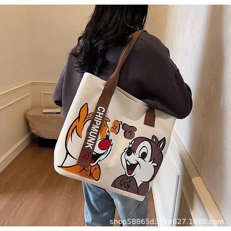 新款帆布包包女2025新款可爱卡通手提袋休闲百搭大容量单肩托特包