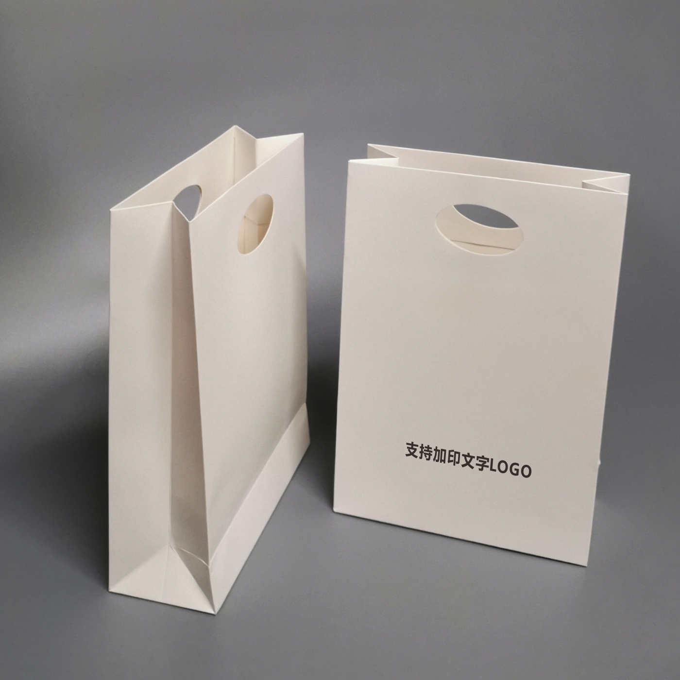 冲孔手提袋订制logo印刷个性时尚礼品袋定做纸袋子无字通用商务