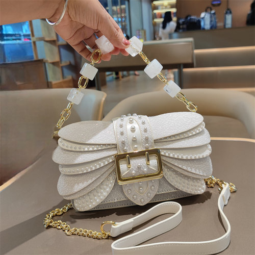 轻奢质感珍珠铆钉翅膀链条小包