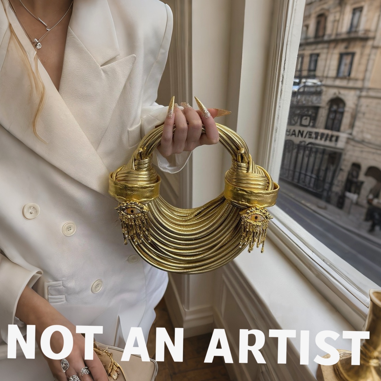 实拍!2025新款高级感小众设计个性眼睛流苏吊坠宴会手拿包斜挂包