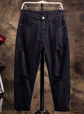 纯黑色弹力高端破洞9分牛仔裤男潮宽松2022年夏季九分小脚哈伦裤