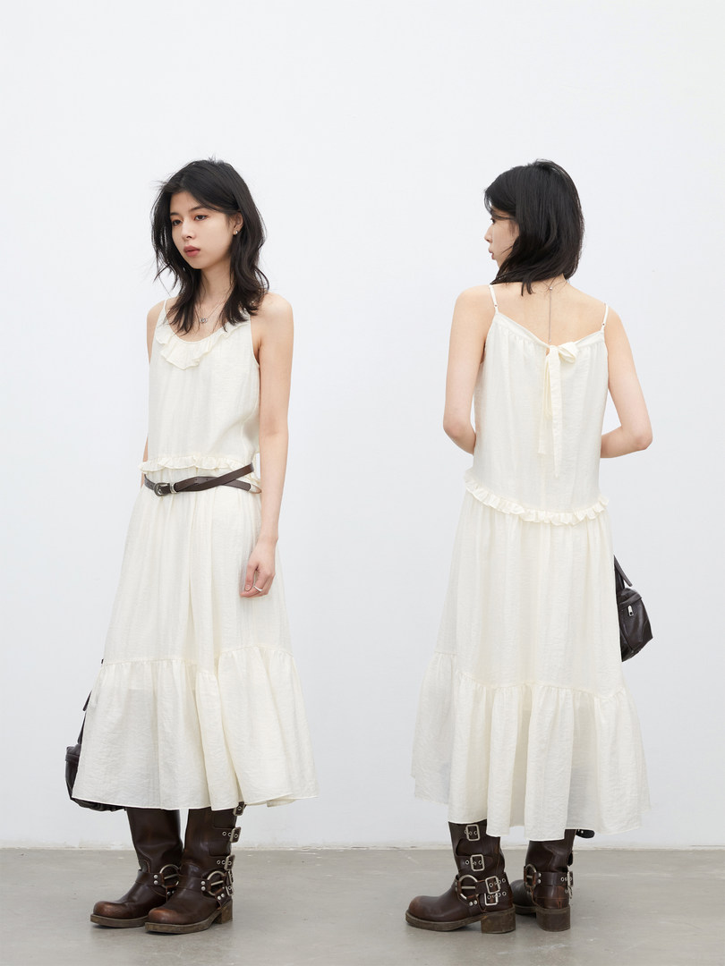 Cream sleeveless midi dress worn by a model, shown from front and back