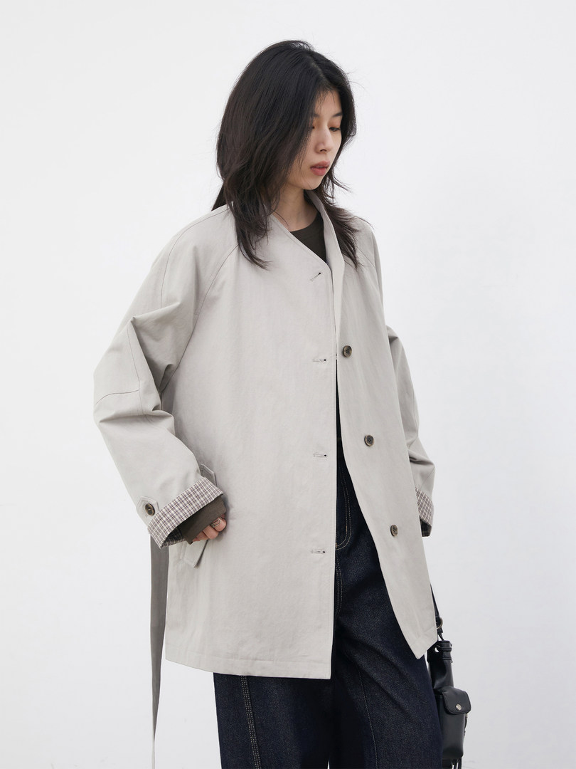 Model wearing a light gray oversized coat jacket