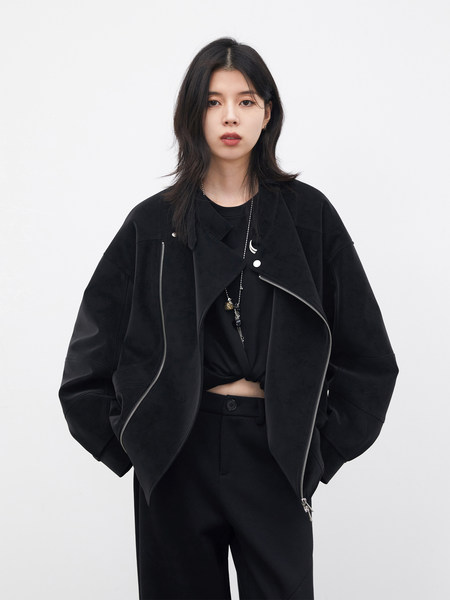 Model wearing a black oversized jacket and black pants