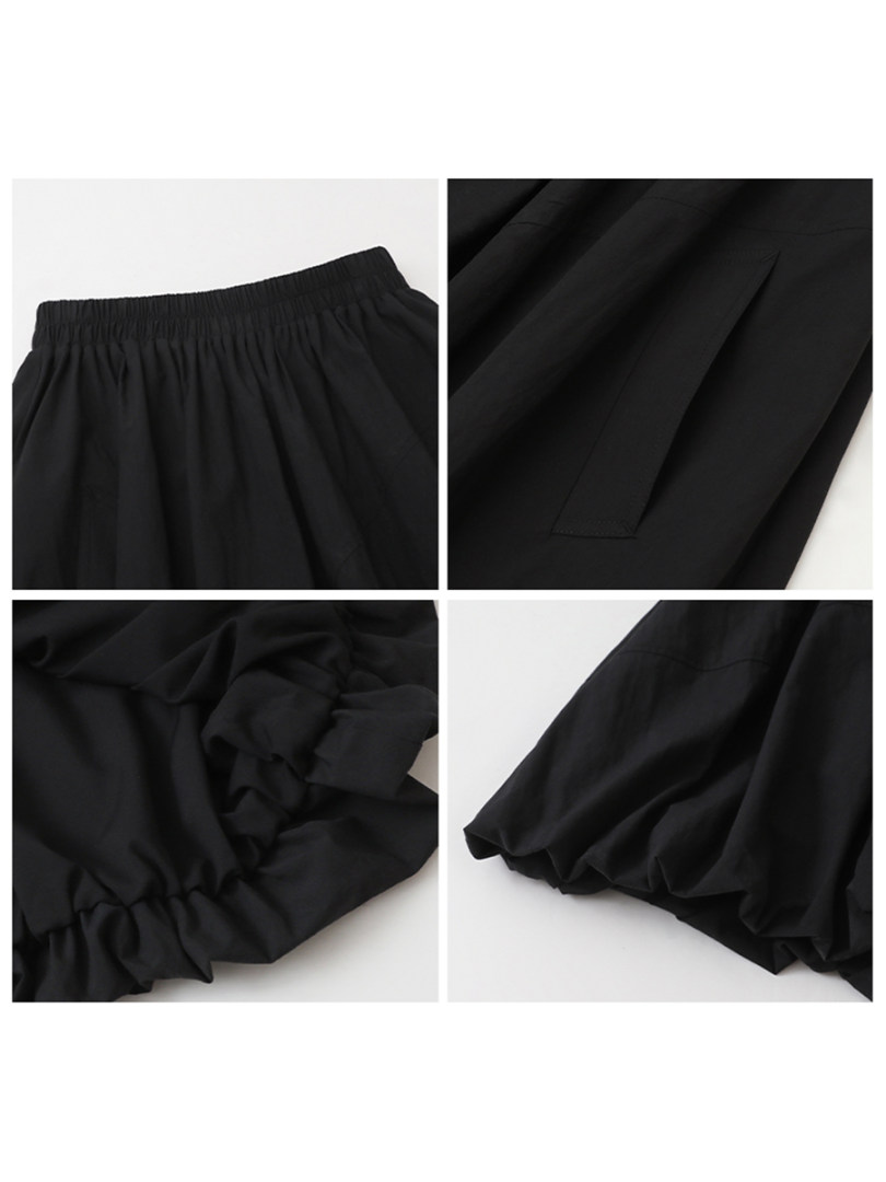 Black pants or skirt shown in close-up flat-lay views
