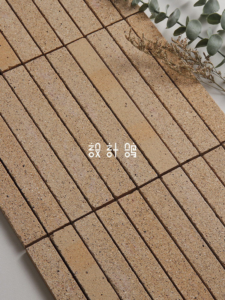 米黄通体长条陶土砖马赛克服装店