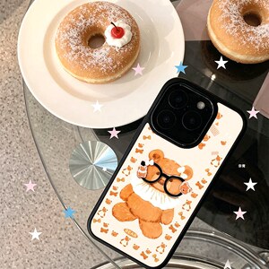 ins可爱眼睛小熊适用苹果17手机壳iPhone16创意15promax新款14高级12小众女x黑色肤感玻璃13mini全包防摔硬壳