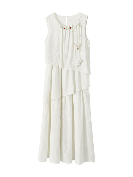 White sleeveless tiered dress on a plain background
