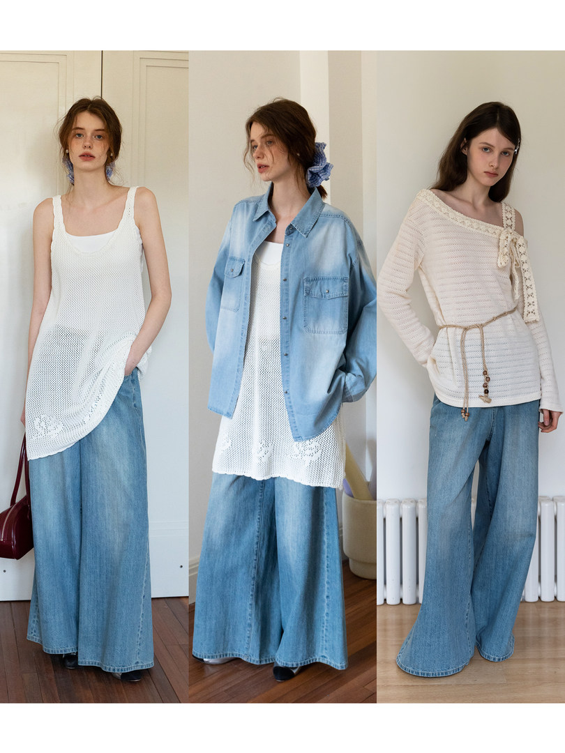 Three models wearing white knit tops styled with wide-leg blue jeans and a light denim shirt