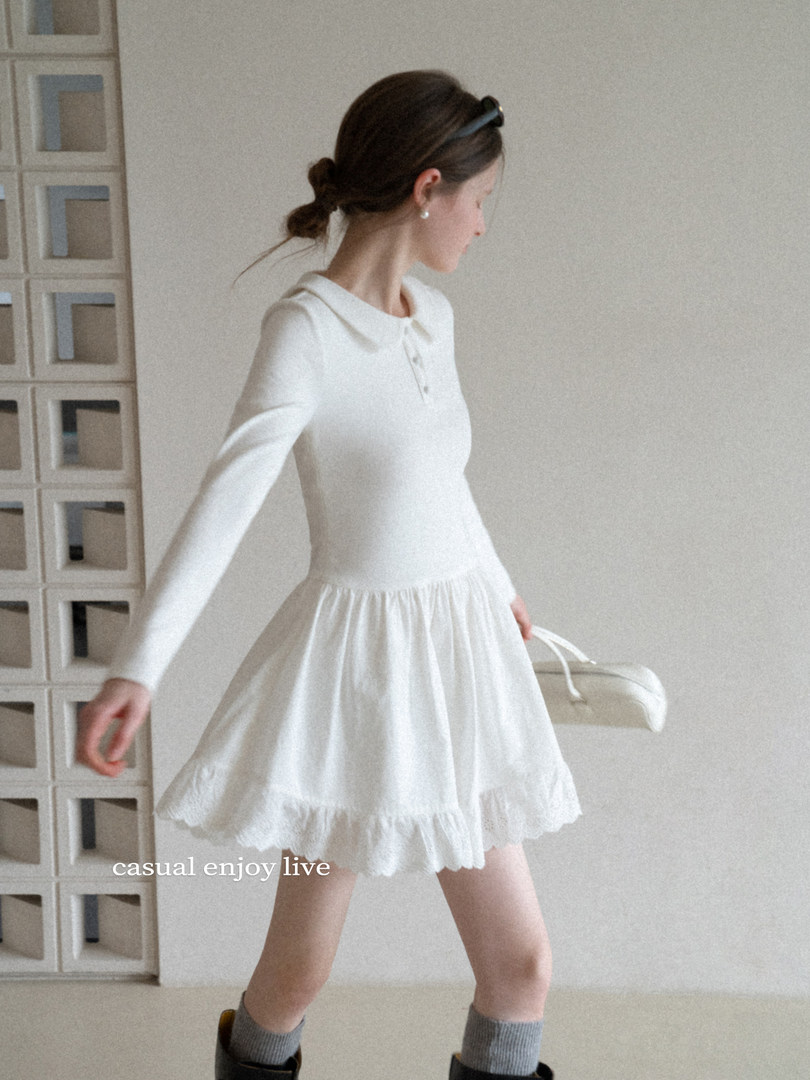 Woman wearing a white long-sleeve ruffled dress