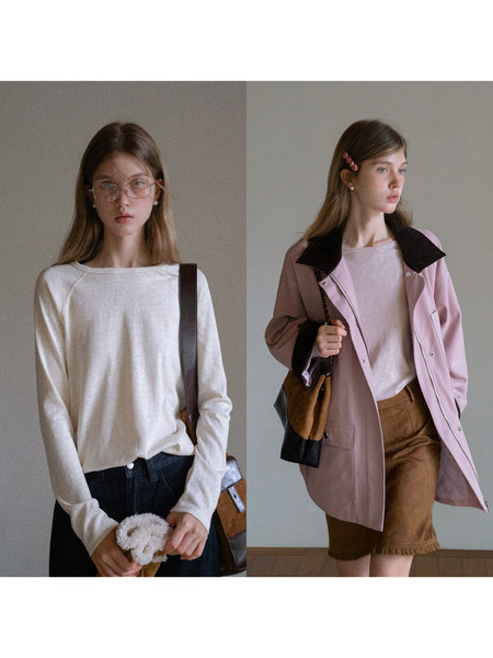 Fashion model wearing casual clothing including a long-sleeve top, jacket, and skirt or pants