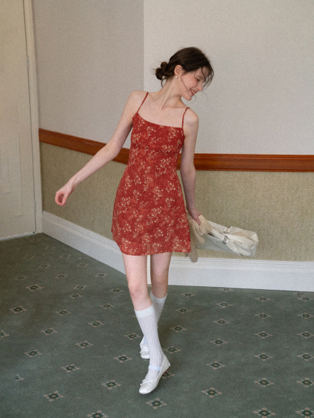 Red floral spaghetti-strap mini dress worn by a model
