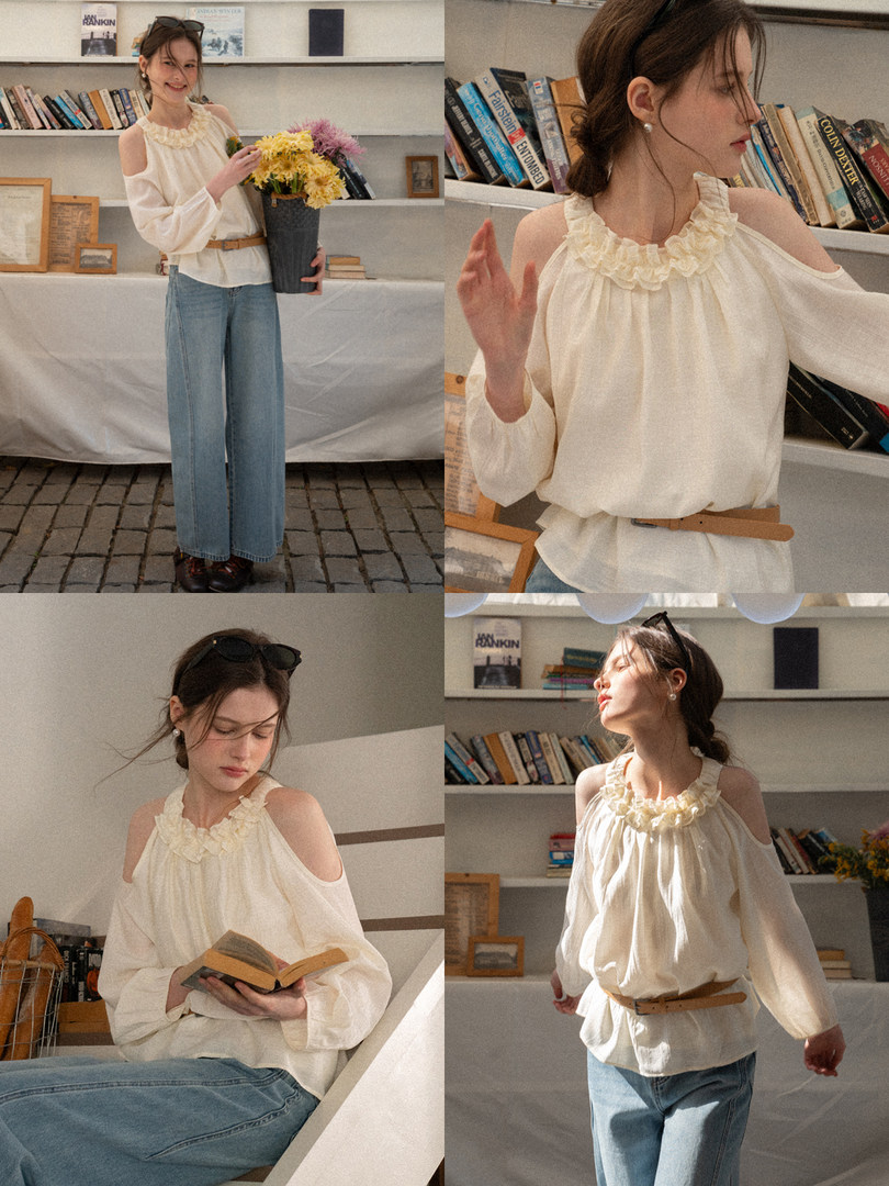 Cream cold-shoulder ruffled blouse worn by a model