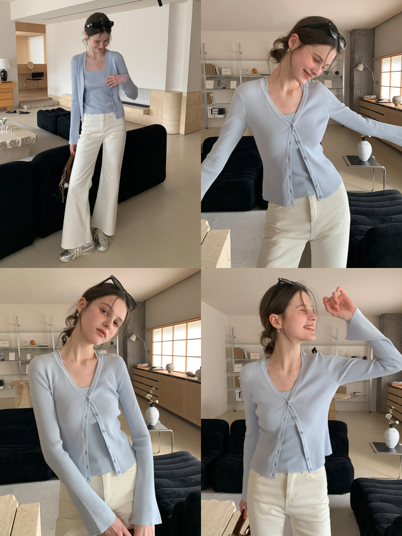 Light blue cardigan with cream wide-leg pants worn by a model indoors