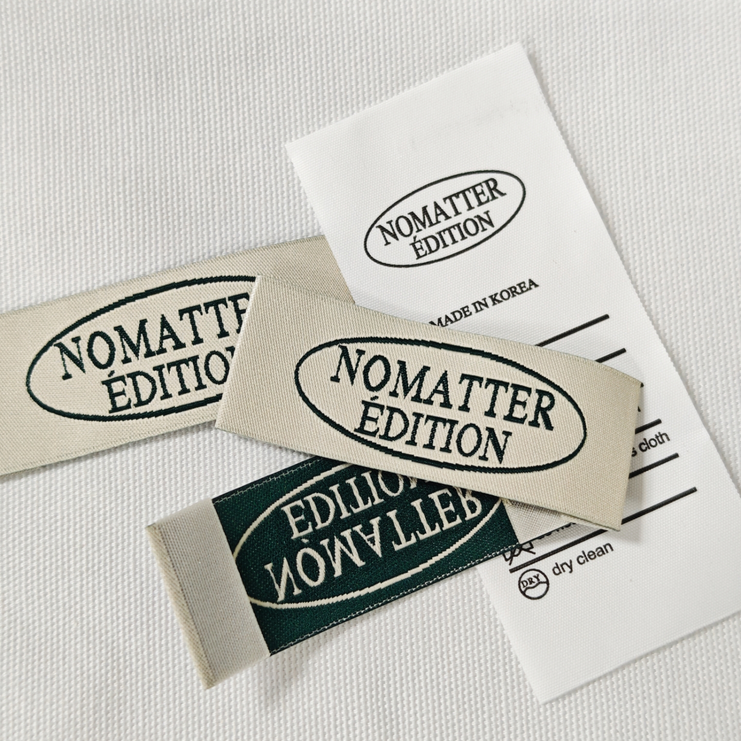 NOMATTER韩国领标洗水标现货，织唛布标侧标内衣带水洗唛主唛定制