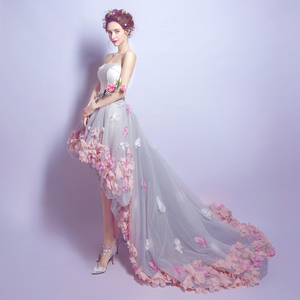 Tailed bride wedding dress after a short long brigade of romantic petals