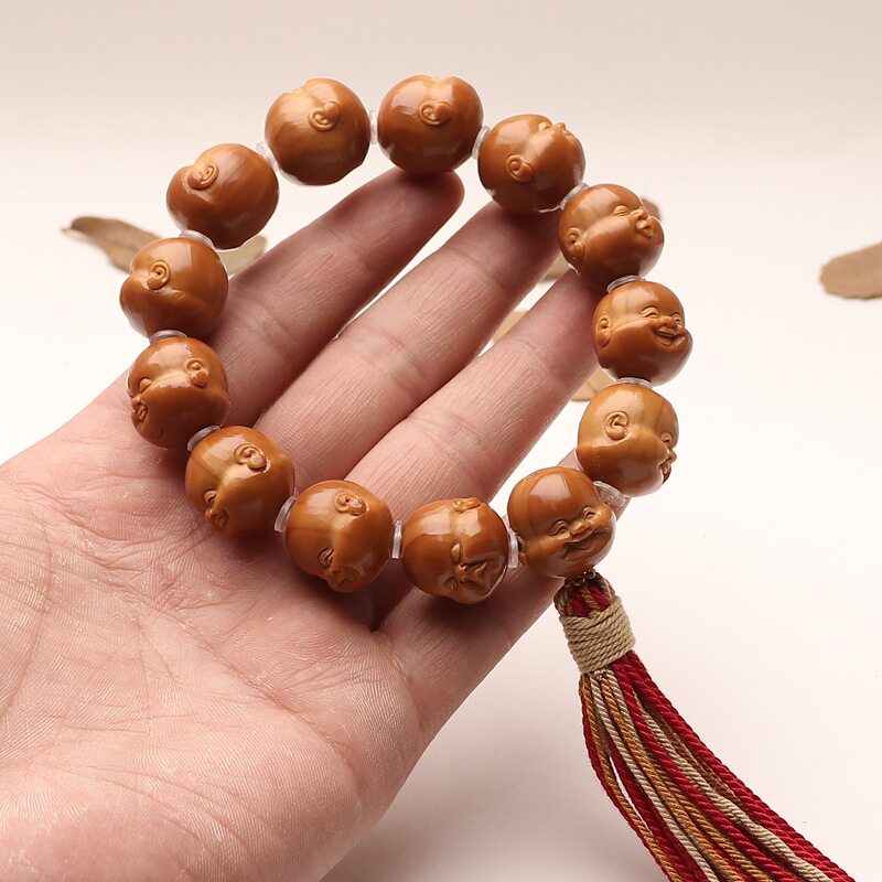 短圆铁核手工雕刻橄榄核三通款十分开心百态手持把件文玩淘气弥勒