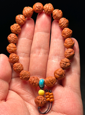 龙纹桃核雕刻小财神手串