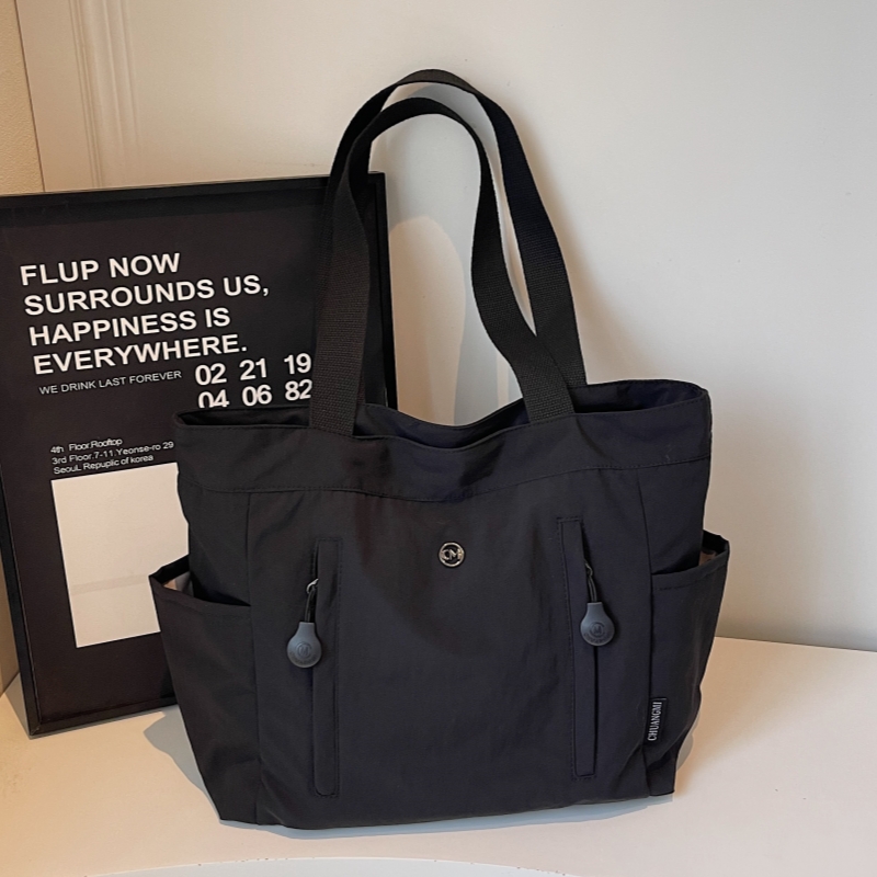 韩版帆布托特包包女2025新款大容量手提通勤包简约百搭休闲单肩包