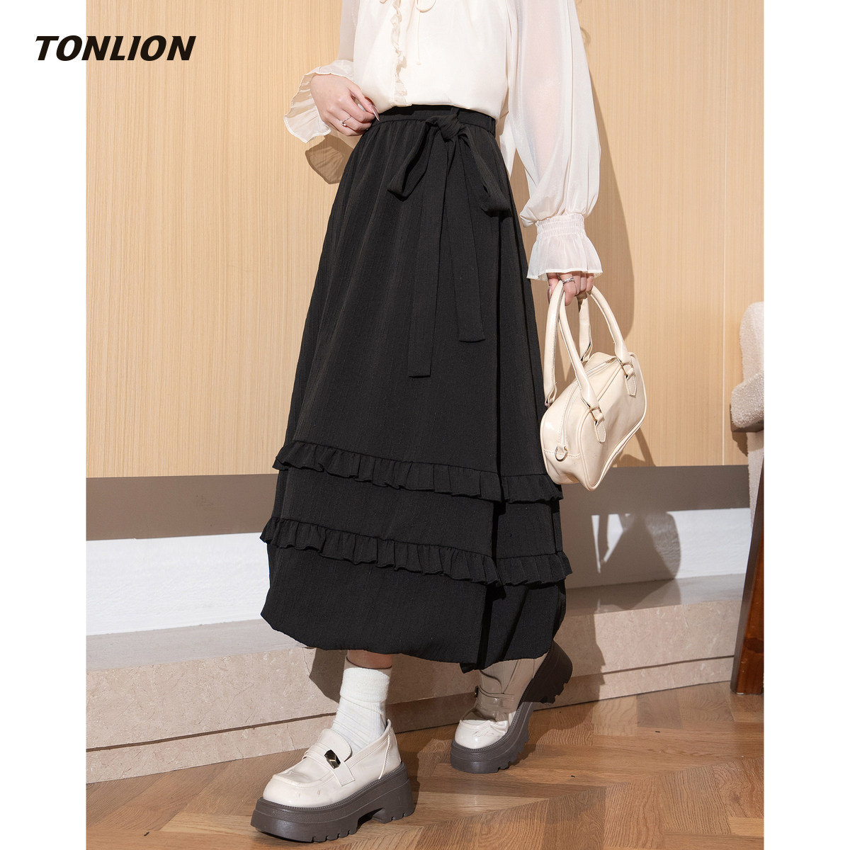 唐狮黑色花苞半身裙女2025冬季新款高腰显瘦高级感小个子a字长裙