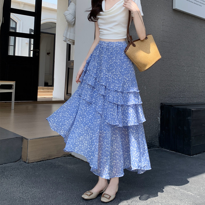 不规则荷叶边蓝色半身裙女2026夏季气质温柔度假风减龄时尚碎花裙