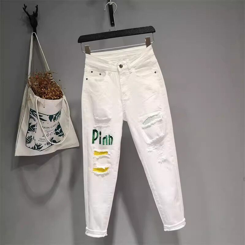 白色牛仔裤女2026春夏新薄款小脚哈伦九分裤时尚修身破洞贴布烫钻