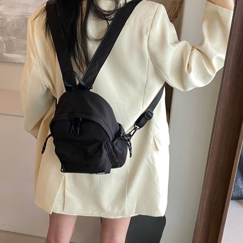 休闲简约女迷你防水通勤双肩包