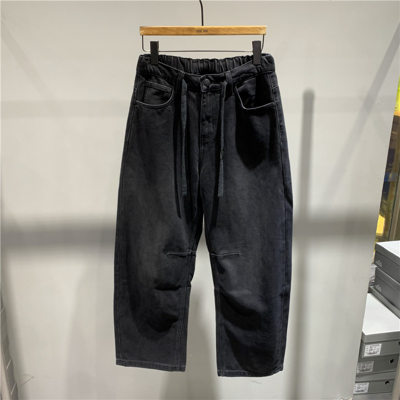 水洗磨毛加绒松弛弯刀牛仔裤男