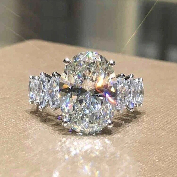 欧美椭圆形镶嵌S925银透明人造海蓝宝新娘戒指婚礼仿真钻戒指环女