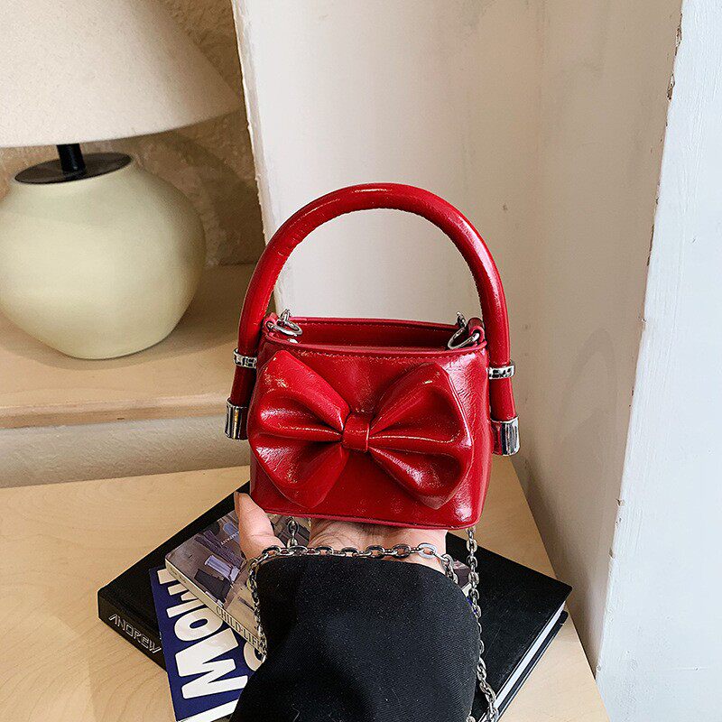 新款纯色儿童包韩版洋气公主手提包简约蝴蝶结迷你单肩背包斜挎包