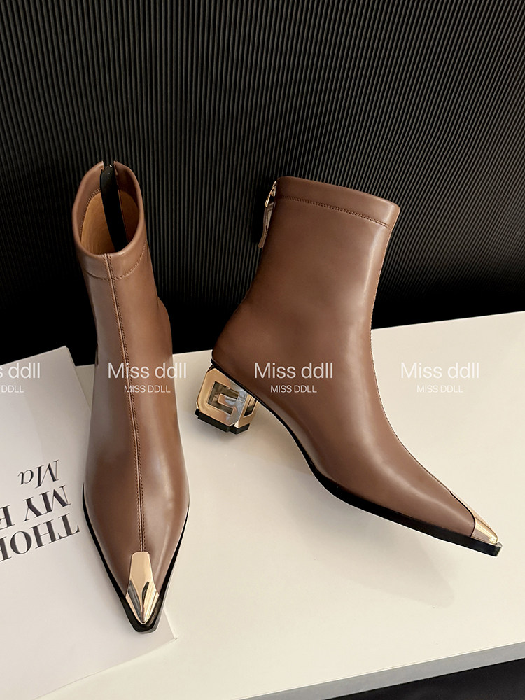 Brown pointed-toe ankle boots with metallic toe caps and block heels