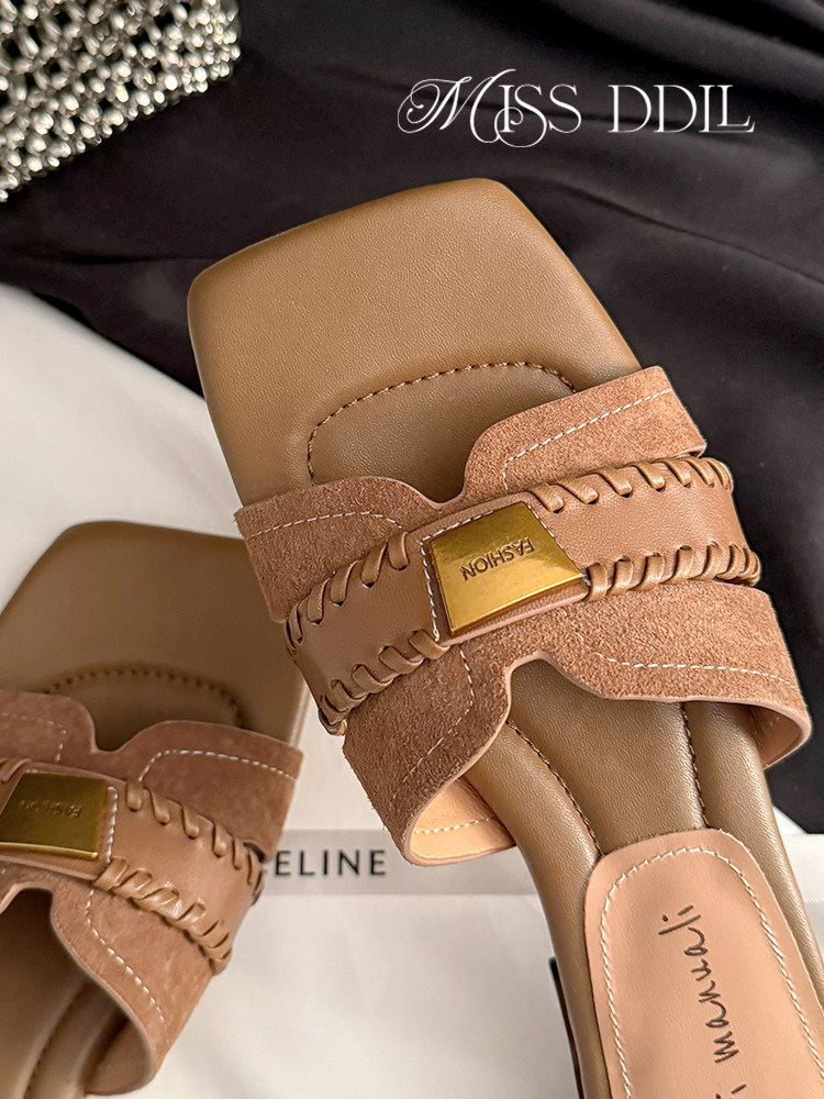 Pair of tan open-toe sandals with suede straps and gold hardware