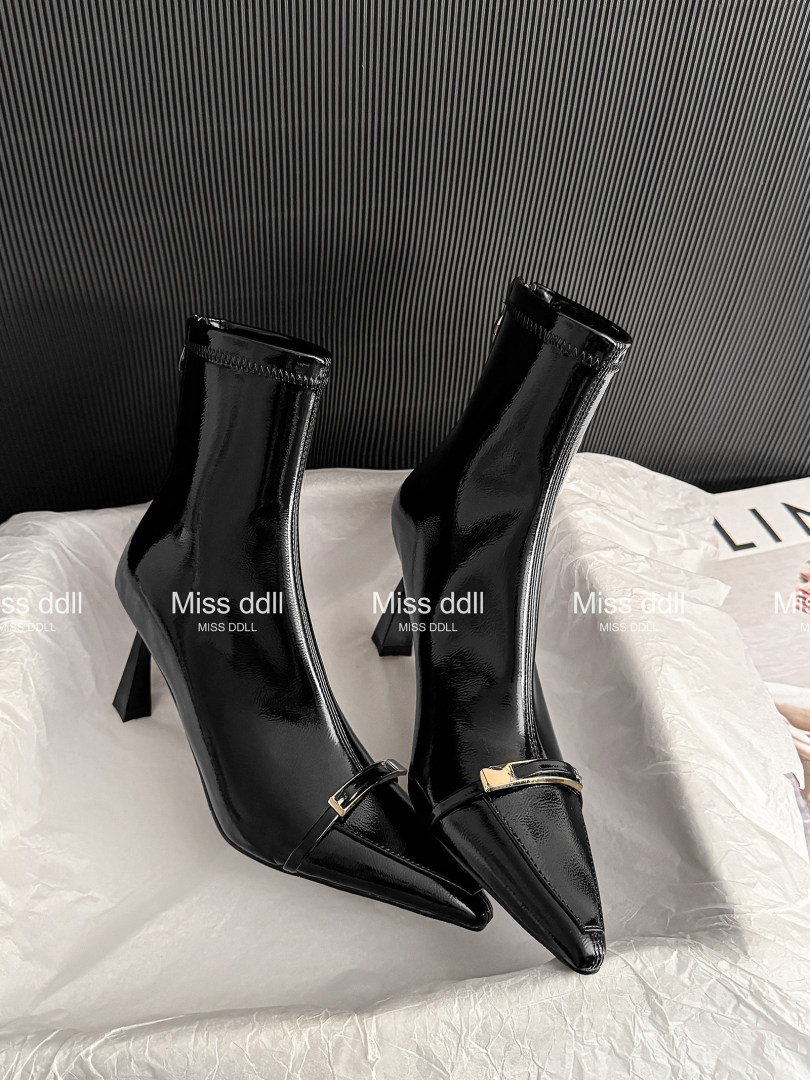 Black glossy pointed-toe ankle boots with high heels