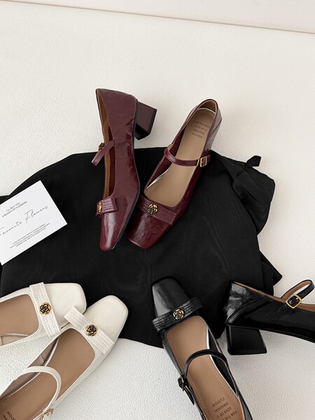 Assorted Mary Jane high-heel pumps in burgundy, white, and black