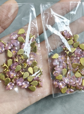 H039 7x10mm粉色铜托水滴锆石30克约45颗