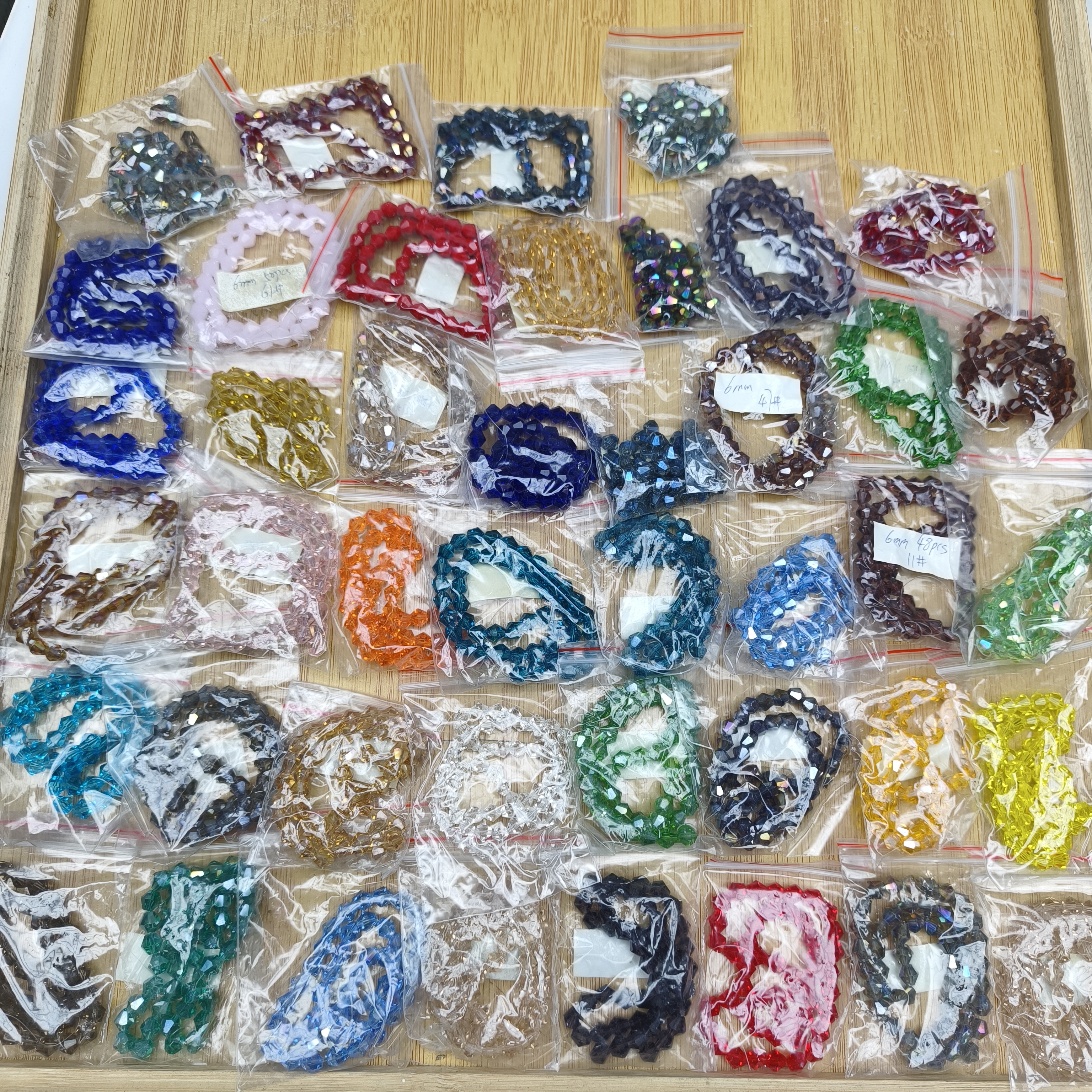 m596 6mm全新整包整条水晶尖珠随机10包