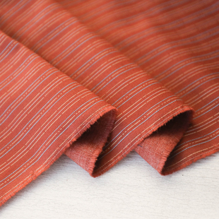 日本进口薄款铁锈红色竖条纹细腻编织印花棉麻混纺面料设计师布料