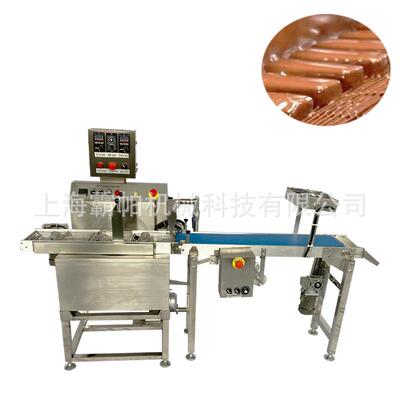 PE系列小型巧克力涂层机可以用来涂层各种食品，比如巧克力涂层蛋