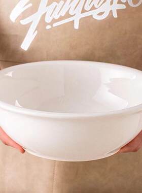 Plain white ceramic salad bowl deep soup plate chopped peppe