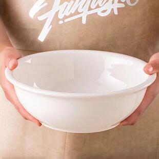 Plain white ceramic salad bowl deep soup plate chopped peppe