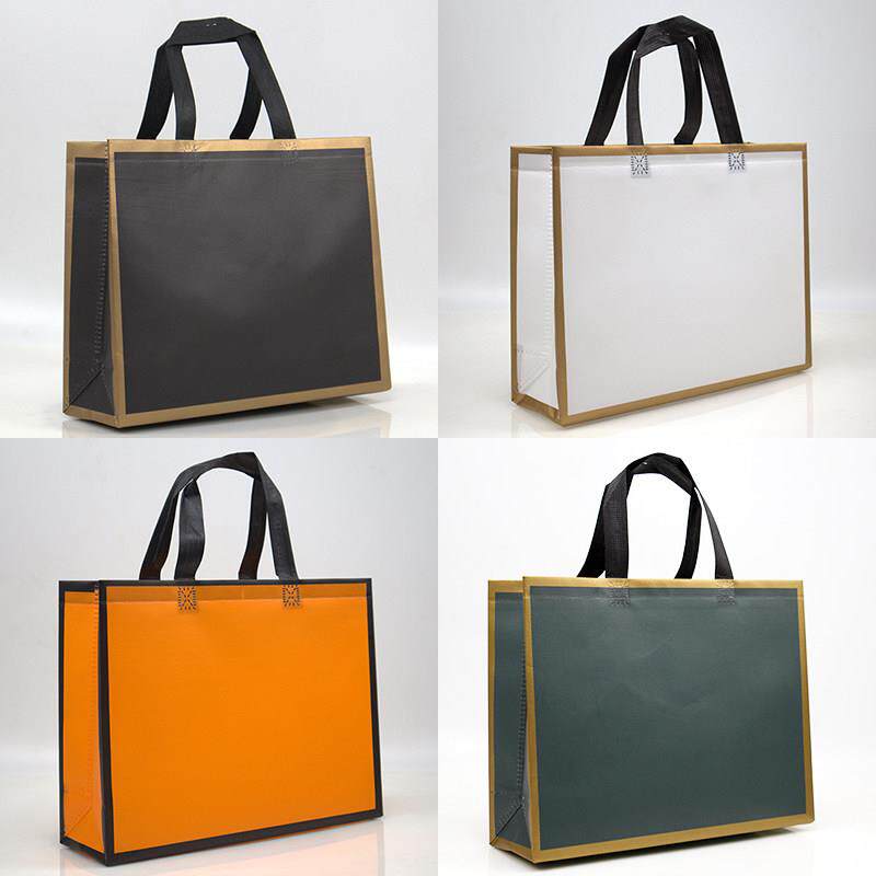 新涂层无纺布袋妇女手提包简单的礼品包装袋金框架袋自定义标志