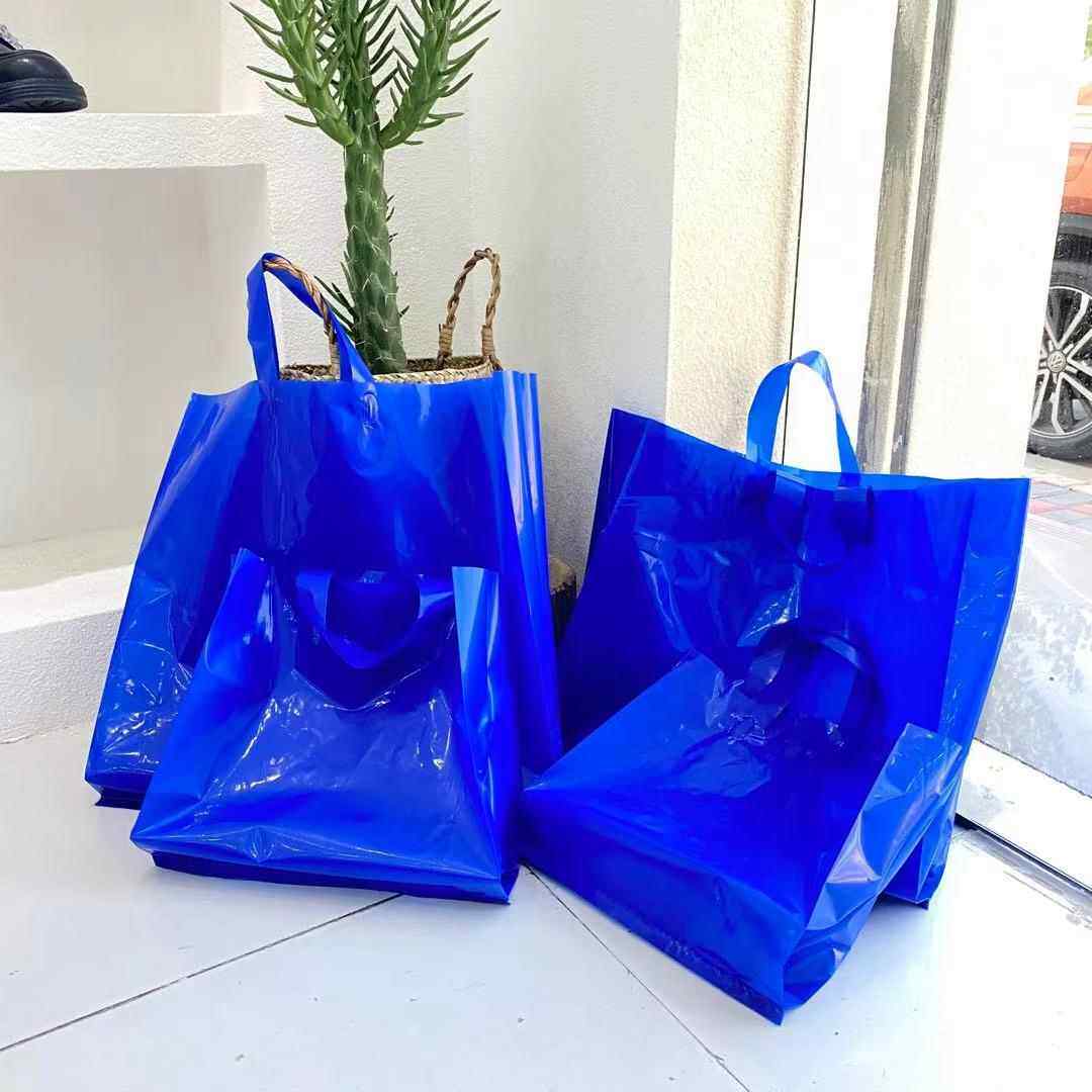 新款直销克莱因蓝网红塑料服装店手提袋子礼品包装购物袋花朵加厚