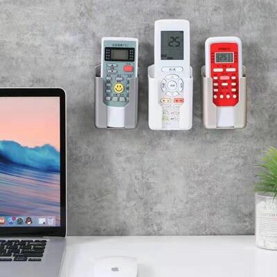 Wall-mounted storage box for home air conditioner remote con