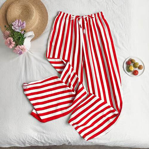 A women's Korean style lazy red and white striped wide leg
