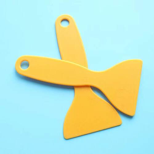 A small cleaning spatula that doesn't damage floors or glass